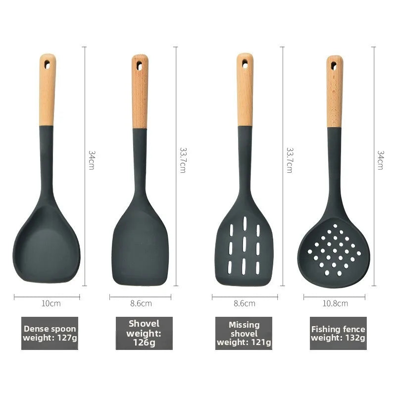 Silicone kitchenware set with wooden handles. Kitchen tools: silicone spatula, strainer, frying spatula
